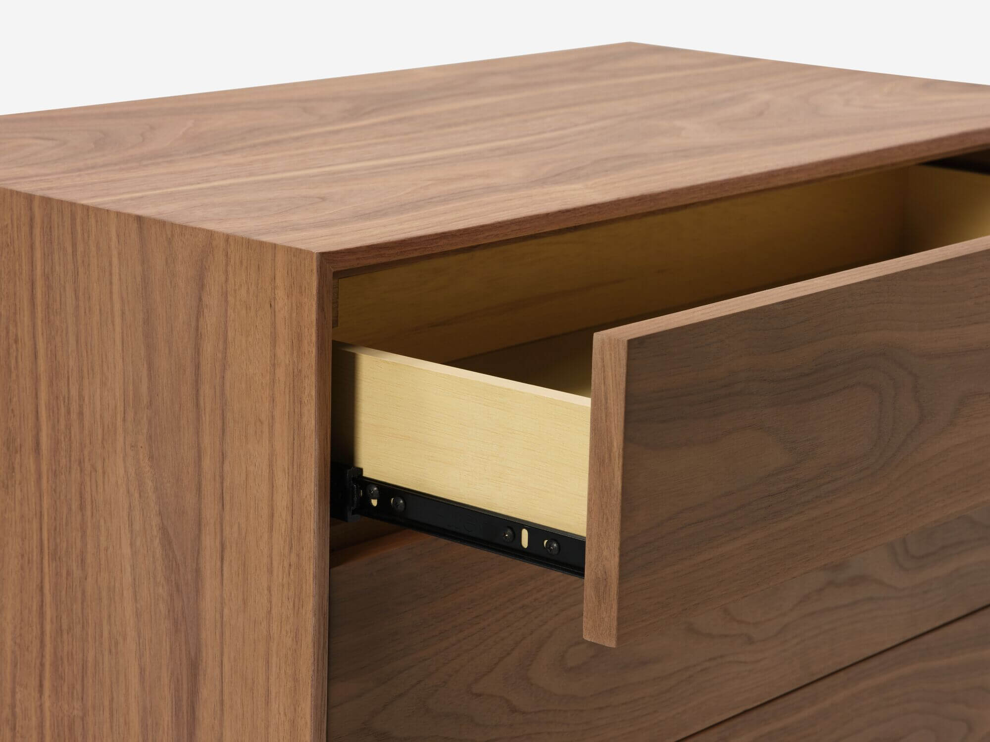Detail view of walnut mid century floating chest of drawers with top drawer open